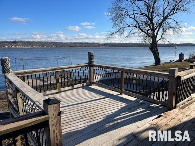 view of dock with a deck with water view