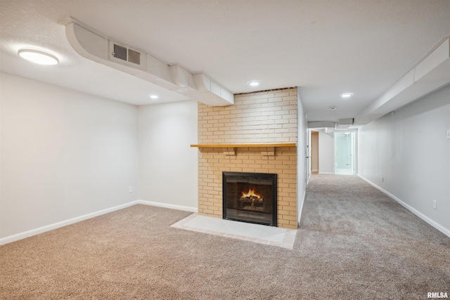 unfurnished living room with a brick fireplace and carpet flooring