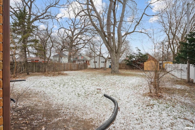 view of yard covered in snow