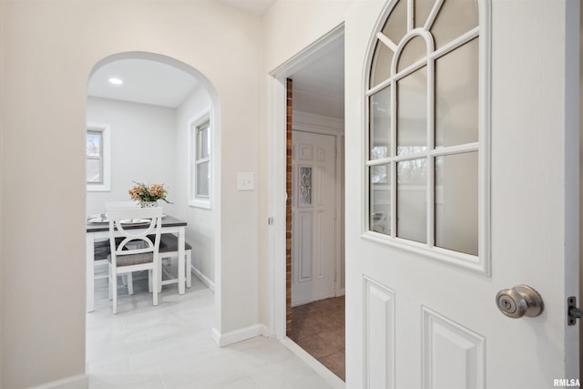 hallway with light tile patterned flooring