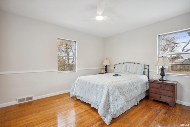 bedroom with hardwood / wood-style flooring and ceiling fan