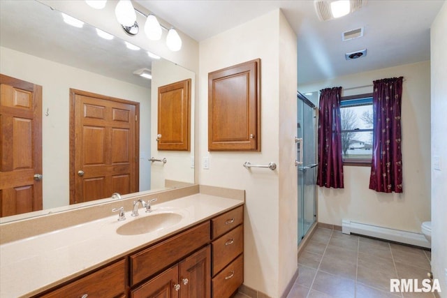 bathroom with walk in shower, tile patterned flooring, a baseboard heating unit, toilet, and vanity