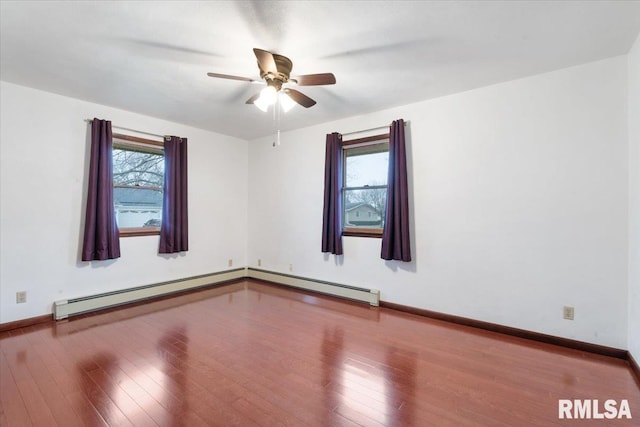 unfurnished room featuring hardwood / wood-style flooring, a baseboard radiator, and ceiling fan