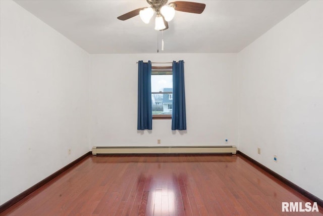 empty room featuring baseboard heating, ceiling fan, and hardwood / wood-style floors