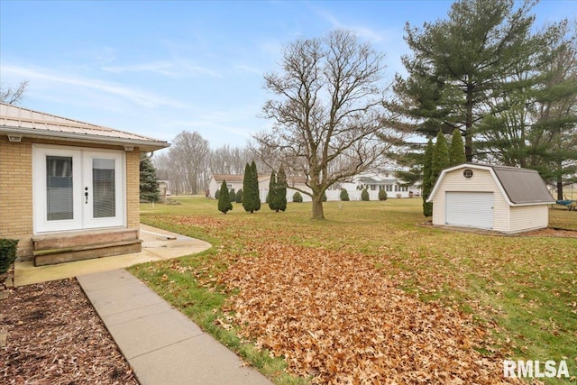 view of yard featuring french doors and a shed