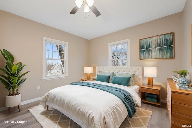 bedroom with ceiling fan and light wood-type flooring