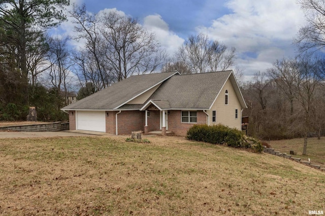 view of front of property featuring a garage and a front yard