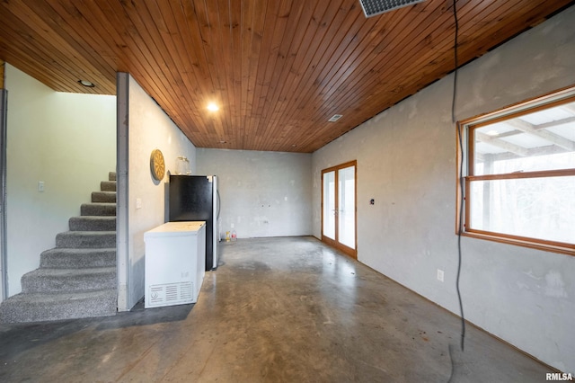 unfurnished room featuring wood ceiling and french doors