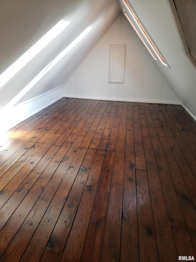 bonus room featuring vaulted ceiling and dark hardwood / wood-style floors