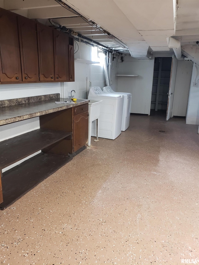 basement featuring washer and clothes dryer