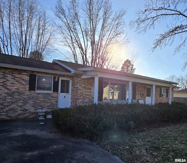 single story home with brick siding