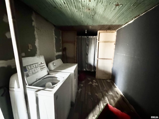 laundry area featuring washer and dryer, dark wood-type flooring, and wooden ceiling