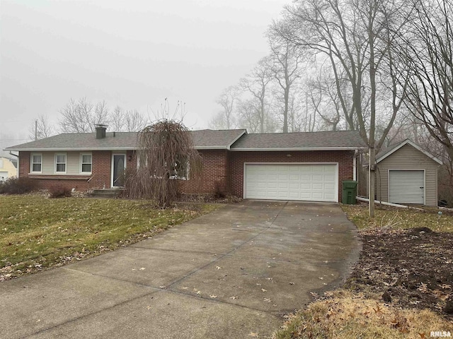 single story home featuring a front yard and a garage