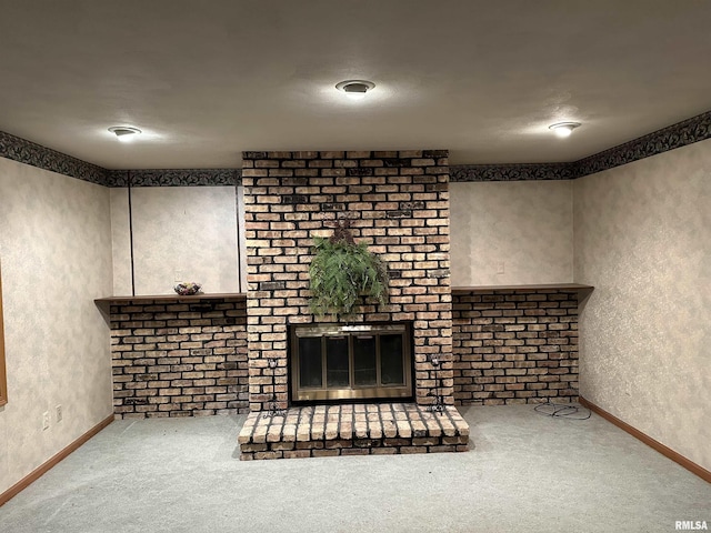 carpeted living room with a fireplace and a textured ceiling