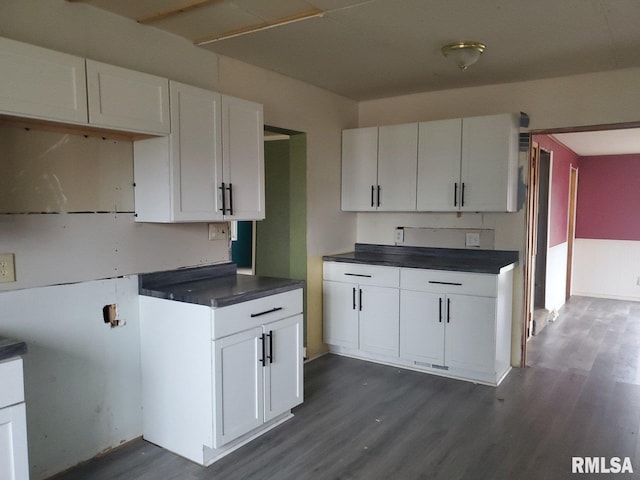 kitchen with white cabinets and dark hardwood / wood-style floors