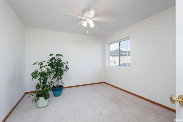 carpeted empty room with ceiling fan