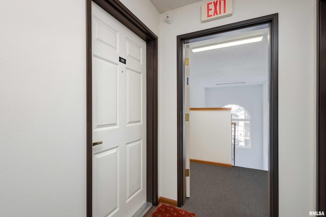 hall with carpet floors