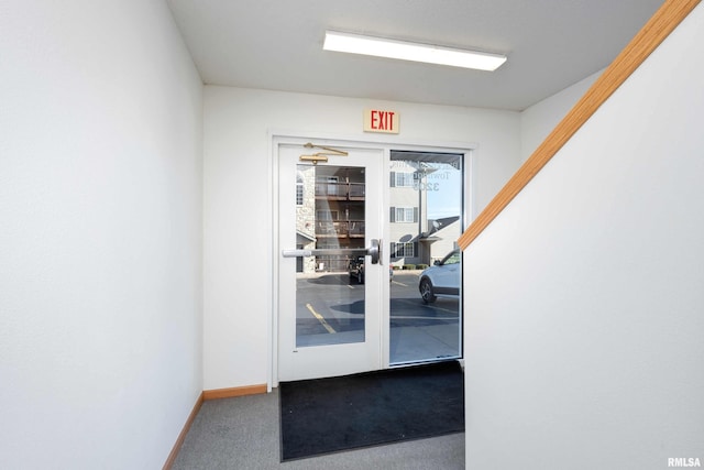 doorway to outside with carpet