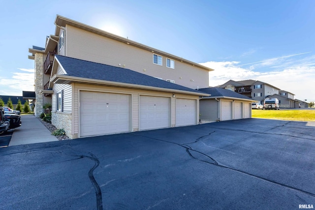 view of side of property featuring a garage