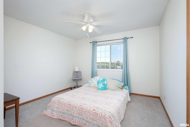 bedroom with light colored carpet and ceiling fan