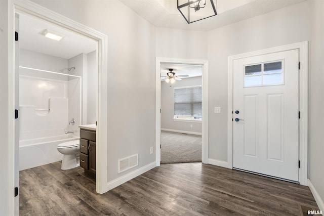 foyer entrance featuring ceiling fan and dark hardwood / wood-style floors