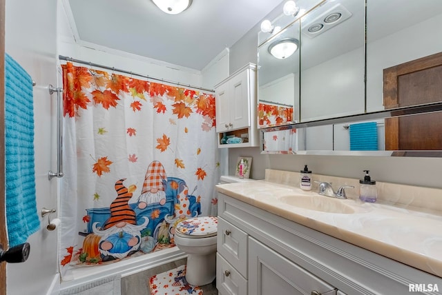 bathroom featuring vanity, ornamental molding, and toilet