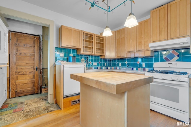 kitchen featuring wood counters, light brown cabinetry, white appliances, a kitchen island, and hanging light fixtures