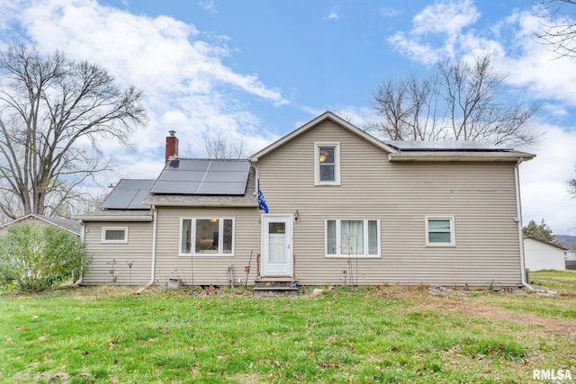 back of house featuring a yard