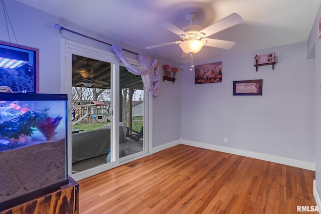 unfurnished room featuring wood-type flooring and ceiling fan