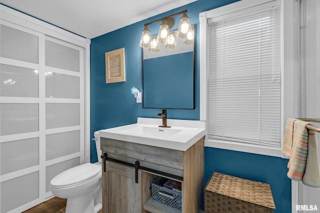 bathroom with vanity and toilet