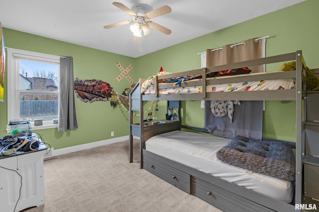 bedroom with light carpet and ceiling fan