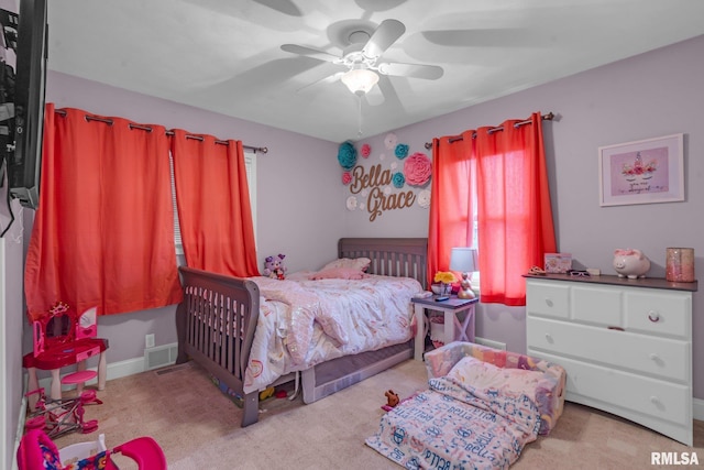 bedroom featuring ceiling fan and light carpet