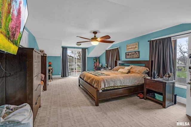 carpeted bedroom featuring ceiling fan, lofted ceiling, and access to outside