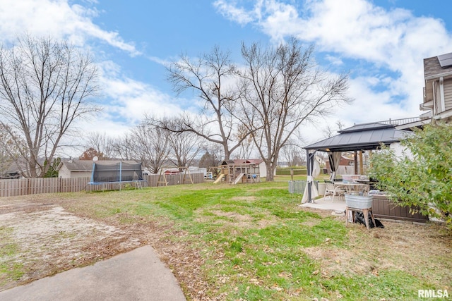 view of yard with a playground, a gazebo, a patio, and a trampoline