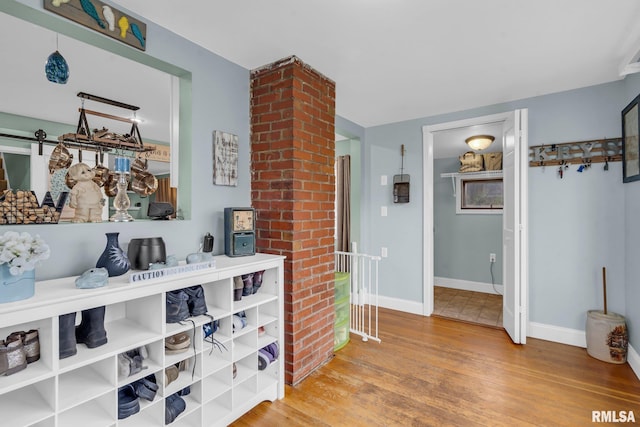 hall with wood-type flooring