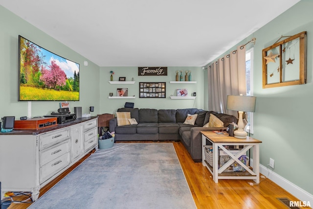 living room with light hardwood / wood-style floors