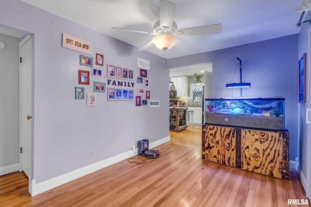 interior space with ceiling fan and light wood-type flooring