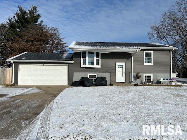 raised ranch featuring a garage