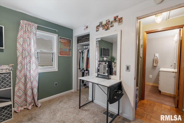 interior space featuring parquet floors and sink