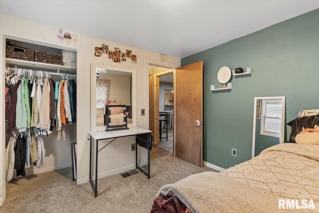 carpeted bedroom with a closet