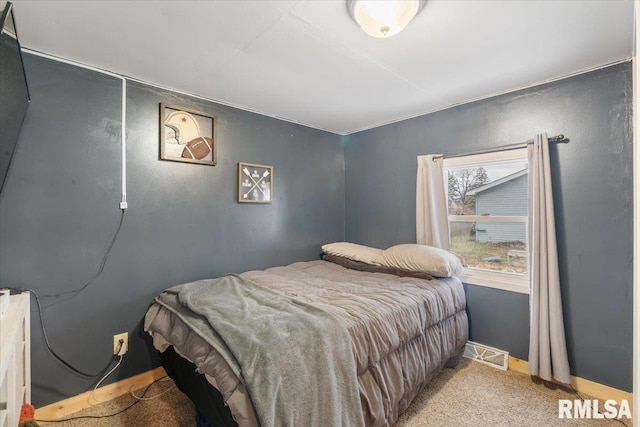 bedroom with light carpet