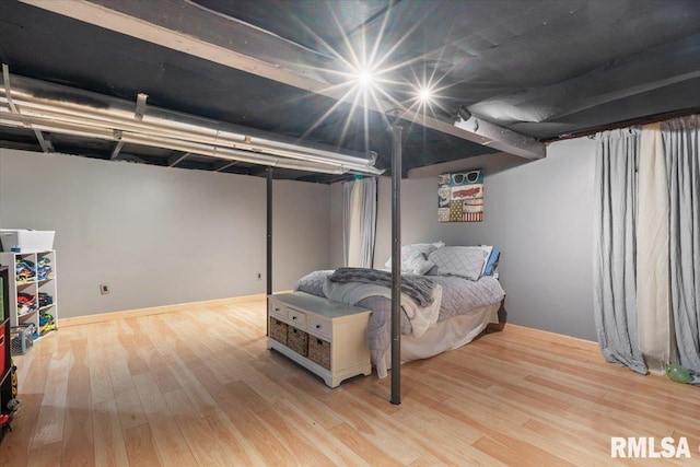 bedroom with light wood-type flooring