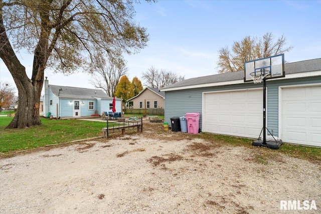 garage featuring a yard