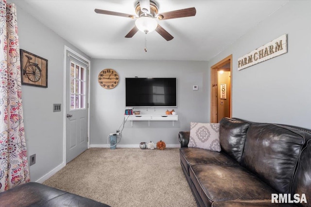 living room featuring carpet flooring and ceiling fan