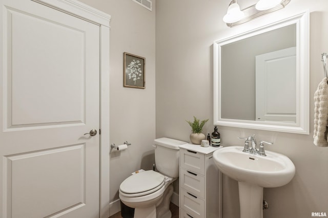 bathroom with toilet and sink