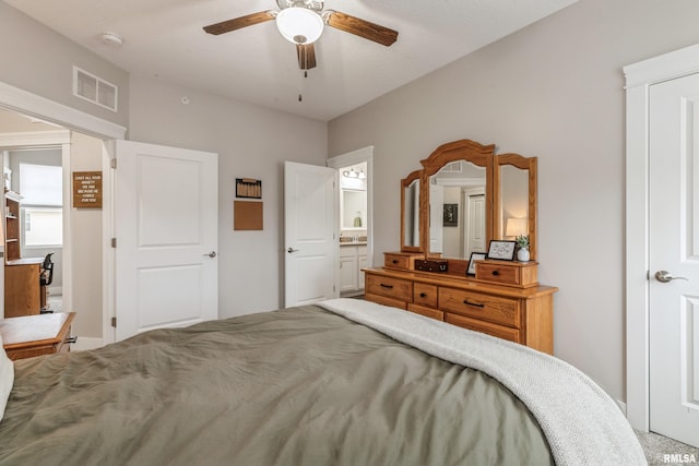 bedroom featuring ensuite bath, ceiling fan, and carpet floors