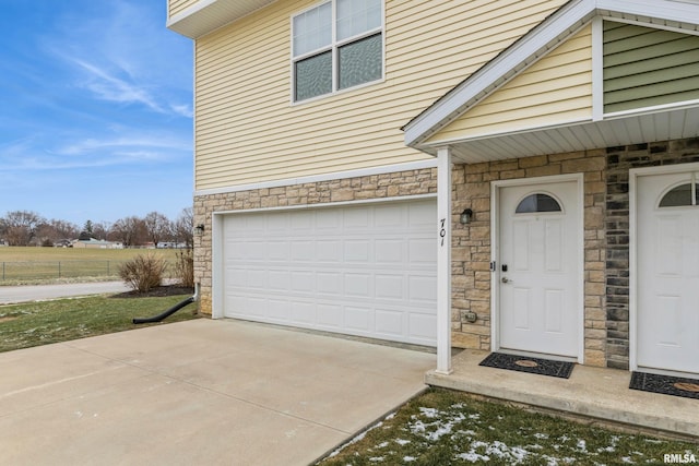 view of exterior entry with a garage