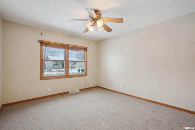 unfurnished room with carpet floors and ceiling fan