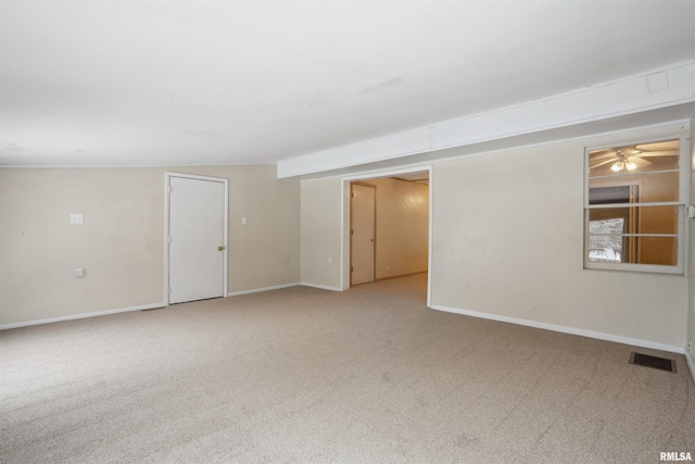 carpeted empty room featuring ceiling fan