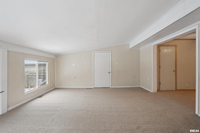 unfurnished room featuring light colored carpet